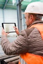 Construction supervisor with digital tablet on site Royalty Free Stock Photo