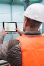 Construction supervisor with digital tablet on site Royalty Free Stock Photo
