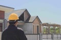 Construction Supervisor, Engineer Stand and watch the house under construction Single story house Seen building structure, masonry