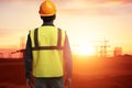 Construction Supervisor Overseeing Site at Sunset Royalty Free Stock Photo