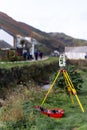 Construction survey digital analogue laser dot equipment on tripod surveying building Royalty Free Stock Photo