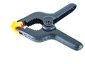 Construction tool black plastic clothespin on a white background Royalty Free Stock Photo