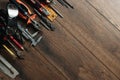 A construction tool on a brown wooden background. View from above. Picture background, screensaver. The concept of construction, r