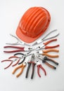 Hard hat with pliers and tongs