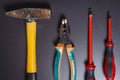 Construction tools on black background. Hammer, pliers, screwdrivers. Repair concept. Royalty Free Stock Photo