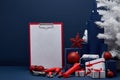 Construction tools, blank clipboard and Christmas decorations. Christmas and New Year construction Royalty Free Stock Photo