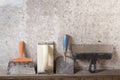 Construction tools on concrete background. Copy space for text. Set of assorted plaster trowel and spatula Royalty Free Stock Photo