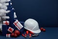 Construction tools, hard hat and Christmas decorations. Christmas and New Year construction Royalty Free Stock Photo