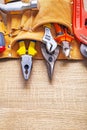Construction tools in toolbelt nippers pliers Royalty Free Stock Photo