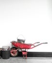 The construction tools of the wheelbarrow and the bucket for cement dough Royalty Free Stock Photo