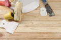 Construction tools and white helmet on wooden background. Copy space for text. Set of assorted plastering tools, spatula Royalty Free Stock Photo