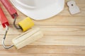 Construction tools and white helmet on wooden background. Copy space for text. Set of assorted plastering tools, spatula Royalty Free Stock Photo