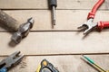 Construction tools on wooden background. Copy space for text. Set of assorted work tool at wood table . Top view