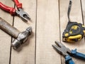 Construction tools on wooden background. Copy space for text. Set of assorted work tool at wood table . Top view Royalty Free Stock Photo