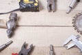 Construction tools on wooden background. Copy space for text. Set of assorted work tool at wood table . Top view