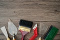 Construction tools on wooden background.  Set of assorted plaster trowel tools and spatula . Copy space for text Royalty Free Stock Photo