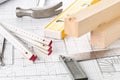 Construction tools and wooden strips on architectural blueprint house building plan Royalty Free Stock Photo