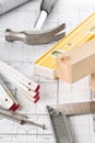 Construction tools and wooden strips on architectural blueprint house building plan Royalty Free Stock Photo