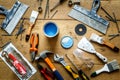 Construction tools on a wooden table with blue paint Royalty Free Stock Photo