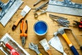 Construction tools on a wooden table with blue paint Royalty Free Stock Photo