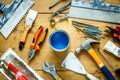 Construction tools on a wooden table with blue paint Royalty Free Stock Photo