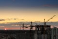 Construction tower crane,Industrial construction cranes on amazing sunset sky background Royalty Free Stock Photo