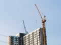 Construction tower crane near building.