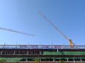 Construction tower crane working at new building site Royalty Free Stock Photo