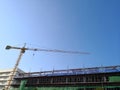 Construction tower crane working at new building site Royalty Free Stock Photo