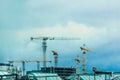 Construction tower industrial cranes on site. Building design, development and work in the creation of urban architecture Royalty Free Stock Photo