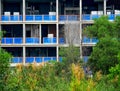 Construction of towerblock with trees and plants in the foreground Vietnam Royalty Free Stock Photo