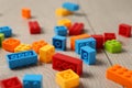 Construction toy. Colorful building bricks on wooden background, closeup Royalty Free Stock Photo
