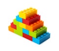 Construction toy. Pyramid made with building bricks isolated on white Royalty Free Stock Photo