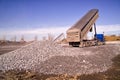 Construction truck tipping dumping gravel