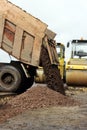 Construction truck unloads ground to the construction site and road widening Royalty Free Stock Photo