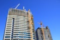 Construction of two high-rise buildings Royalty Free Stock Photo