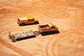 Construction vehicles and car traces in dust clay