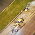 Construction vehicles and workers repairing the night road Royalty Free Stock Photo