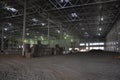 Construction of a warehouse complex, inside view. Columns are installed, crushed stone is laid on the floor Royalty Free Stock Photo