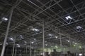 Construction of a warehouse complex, inside view. Columns are installed, crushed stone is laid on the floor