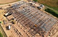 Construction of warehouse from metal structures. Industrial building on light gauge steel framing. Frame of modern hangar or Royalty Free Stock Photo