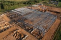 Construction of warehouse from metal structures. Industrial building on light gauge steel framing. Frame of modern hangar or Royalty Free Stock Photo