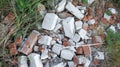 Construction waste. Heap of bricks grass Royalty Free Stock Photo