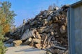 Construction waste, reinforced concrete blocks and rusty fittings. Demolished building with wire reinforced concrete