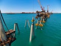 Construction of a wharf showing raked piles ready for headstock placement