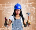 Construction woman with tools, denims overall Royalty Free Stock Photo