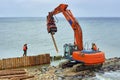 Construction of wooden breakwaters from larch trunks