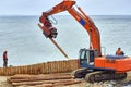 Construction of wooden breakwaters from larch trunks