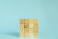 Construction of wooden cubes on blue background with copy space. Mockup composition for design Royalty Free Stock Photo