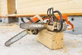 When construction a wooden house, two chainsaws a bit Royalty Free Stock Photo